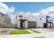 Contemporary two-story home with desert landscaping and two-car garage under a bright blue sky at 10253 E Ursula Ave, Mesa, AZ 85212