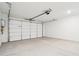 Spacious two car garage with sealed concrete floors and modern garage door at 10253 E Ursula Ave, Mesa, AZ 85212