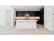 Modern kitchen featuring a central island, recessed lighting, and dark cabinetry at 10253 E Ursula Ave, Mesa, AZ 85212