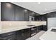 Contemporary kitchen featuring stainless steel appliances, a central island, and plenty of counter space at 10253 E Ursula Ave, Mesa, AZ 85212