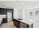 Bright kitchen with a central island, stainless steel appliances, and modern finishes at 10253 E Ursula Ave, Mesa, AZ 85212