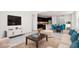 Bright living room featuring a modern kitchen, comfortable seating, and sleek decor at 10253 E Ursula Ave, Mesa, AZ 85212