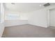 Open and bright loft space with neutral walls and carpet at 10253 E Ursula Ave, Mesa, AZ 85212