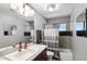 Bathroom featuring a single vanity, bathtub, and modern finishes at 11131 E Becker Ln, Scottsdale, AZ 85259