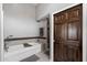 Bathroom showcasing a soaking tub, glass shower, and modern tile work at 11131 E Becker Ln, Scottsdale, AZ 85259
