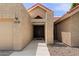 Close up of front entrance featuring desert landscaping and pathway leading to wood double doors at 11131 E Becker Ln, Scottsdale, AZ 85259