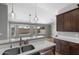 Open kitchen featuring modern stainless-steel appliances and a spacious breakfast bar at 11131 E Becker Ln, Scottsdale, AZ 85259