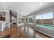 Open living room with hardwood floors, fireplace, and view of the pool and backyard at 11131 E Becker Ln, Scottsdale, AZ 85259