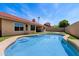 Inviting swimming pool with patio, lush landscaping, and a backyard with recreational space at 11131 E Becker Ln, Scottsdale, AZ 85259