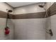 Modern shower with two showerheads and stylish tiling at 11131 E Becker Ln, Scottsdale, AZ 85259