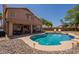 Backyard swimming pool and outdoor dining area feature desert landscaping and privacy at 1125 S Larkspur St, Gilbert, AZ 85296