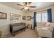 Charming Bedroom with a wooden crib, ceiling fan, white armchair, and whimsical decor at 1125 S Larkspur St, Gilbert, AZ 85296