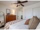 Comfortable bedroom featuring a dresser, closet, and soft, neutral tones at 1125 S Larkspur St, Gilbert, AZ 85296