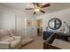 Bright Bedroom with a changing table, white armchair, crib, and closet at 1125 S Larkspur St, Gilbert, AZ 85296
