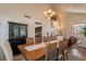 This dining room features a black display cabinet and easy access to the kitchen at 1125 S Larkspur St, Gilbert, AZ 85296