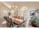 Formal dining area with vaulted ceilings, plantation shutters, and stylish decor at 1125 S Larkspur St, Gilbert, AZ 85296