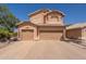 Charming two-story home features a 3-car garage, desert landscaping, and tile roof at 1125 S Larkspur St, Gilbert, AZ 85296