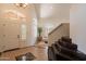 Welcoming foyer with tile flooring, staircase, and ample natural light at 1125 S Larkspur St, Gilbert, AZ 85296