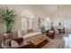 Bright living room features large windows, high ceilings, and elegant furnishings at 1125 S Larkspur St, Gilbert, AZ 85296