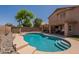 Backyard swimming pool with inviting blue water and shaded outdoor dining area at 1125 S Larkspur St, Gilbert, AZ 85296