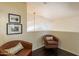 Cozy sitting area with rich dark wood floors and comfortable seating at 1125 S Larkspur St, Gilbert, AZ 85296