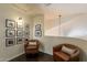 Comfortable landing area with leather chairs and gallery wall at 1125 S Larkspur St, Gilbert, AZ 85296