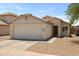 Inviting single-story home featuring a two-car garage and neutral-colored exterior at 11921 W Flores Dr, El Mirage, AZ 85335