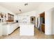 A kitchen featuring white cabinets, laminate counter tops, and tile floors at 11921 W Flores Dr, El Mirage, AZ 85335