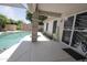A view of the covered patio that adjoins the backyard pool at 1210 W Betty Elyse Ln, Phoenix, AZ 85023