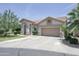 Attractive single-story house with a tile roof and a spacious driveway at 1210 W Betty Elyse Ln, Phoenix, AZ 85023