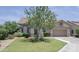 Charming single-story home with lush front lawn and mature landscaping at 1210 W Betty Elyse Ln, Phoenix, AZ 85023