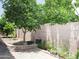 A garden plot along a block wall with greenery and stone pavers at 1210 W Betty Elyse Ln, Phoenix, AZ 85023