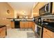 The kitchen is complete with granite countertops, stainless steel appliances, and plenty of cabinet space at 1210 W Betty Elyse Ln, Phoenix, AZ 85023