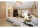 A living room view with tile floors, a sofa and an archway to the hall at 1210 W Betty Elyse Ln, Phoenix, AZ 85023
