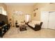 A cozy living room with a sofa and chair, and a decorative area rug at 1210 W Betty Elyse Ln, Phoenix, AZ 85023