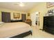 Bedroom with a ceiling fan, open closet, tile floor, and furniture at 1210 W Betty Elyse Ln, Phoenix, AZ 85023