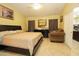 Bedroom featuring tile floor, a ceiling fan, and furniture at 1210 W Betty Elyse Ln, Phoenix, AZ 85023