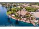 Gorgeous waterfront property featuring a boat dock, covered patio, and desert landscaping at 1241 W Lobster Trap Dr, Gilbert, AZ 85233