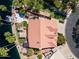 Lakefront property featuring boat dock, fire pit, and tropical landscaping at 1241 W Lobster Trap Dr, Gilbert, AZ 85233