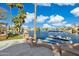 Waterfront backyard oasis complete with a boat dock, paddleboards, built-in fireplace, and lush landscaping at 1241 W Lobster Trap Dr, Gilbert, AZ 85233