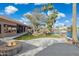 Expansive backyard featuring a patio, outdoor kitchen, pergola, and scenic waterfront views at 1241 W Lobster Trap Dr, Gilbert, AZ 85233