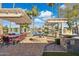 Beautiful backyard featuring an outdoor kitchen, fire pit, gazebo, and waterfront view perfect for entertaining at 1241 W Lobster Trap Dr, Gilbert, AZ 85233