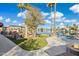 Spacious backyard featuring a fire feature, lake access, and meticulously landscaped grounds at 1241 W Lobster Trap Dr, Gilbert, AZ 85233