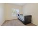 Bedroom with neutral carpet, window and a single bed at 1241 W Lobster Trap Dr, Gilbert, AZ 85233
