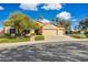 Charming single-Gathering home with a well-maintained front yard, three-car garage, and desert landscaping at 1241 W Lobster Trap Dr, Gilbert, AZ 85233