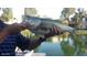 Resident holding a large-mouth bass caught in the community lake at 1241 W Lobster Trap Dr, Gilbert, AZ 85233