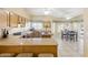 Bright kitchen with a center island, breakfast bar, and stainless appliances at 1241 W Lobster Trap Dr, Gilbert, AZ 85233