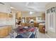 View of kitchen, breakfast table and sitting room with fireplace at 1241 W Lobster Trap Dr, Gilbert, AZ 85233