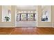 Open-concept living room with large windows with backyard views at 1241 W Lobster Trap Dr, Gilbert, AZ 85233