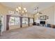 Bright living room with large windows overlooking the backyard at 1241 W Lobster Trap Dr, Gilbert, AZ 85233